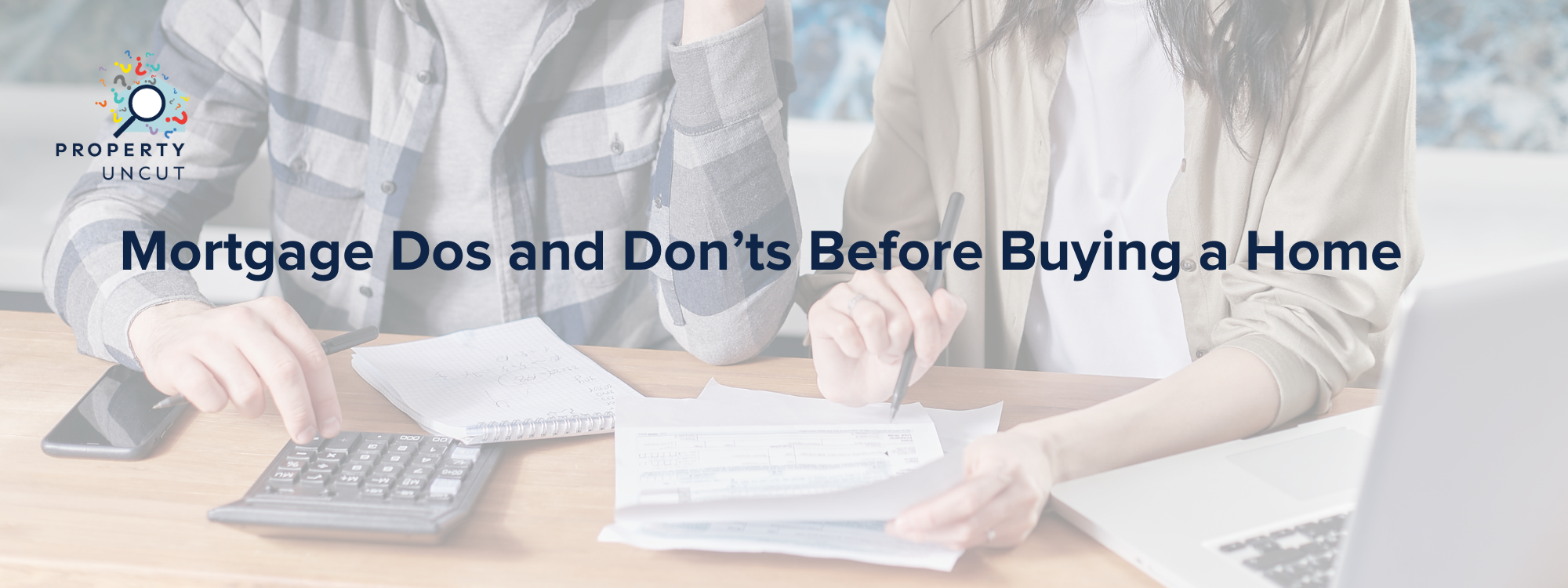 Couple budgeting and reviewing expenses before applying for a home loan in WA.